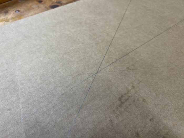 Locate the center of your template by drawing diagonal lines from opposite corners.