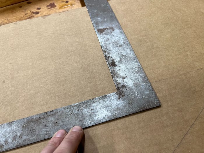 Use a drafting square to mark out a rectangle