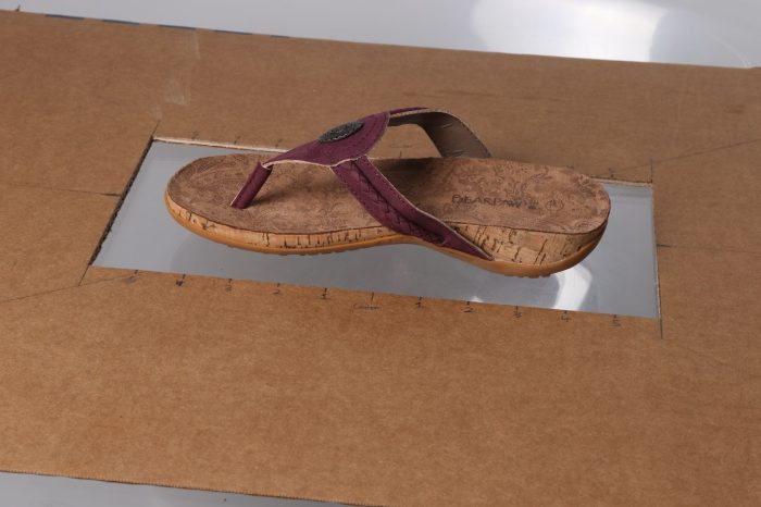 The centering template being used to center footwear.